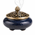 Encensoir rond 15 cm en céramique bleu foncé et métal bronze ajouré décoratif